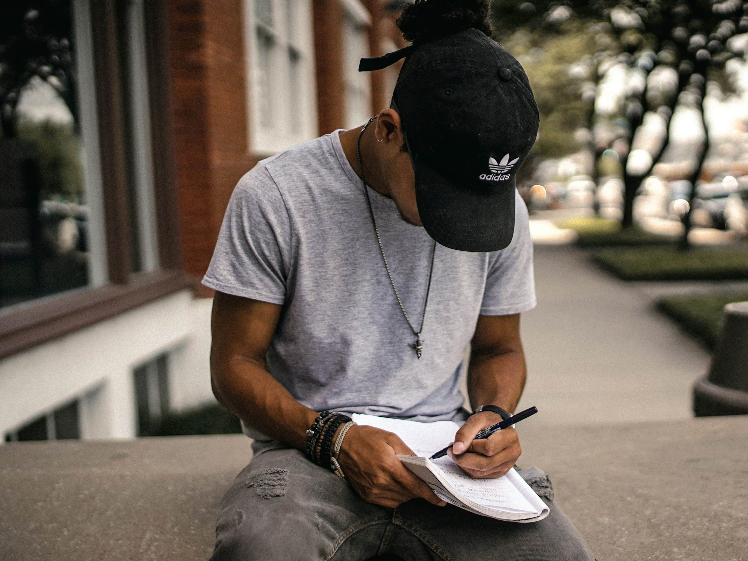 Student writing in a book