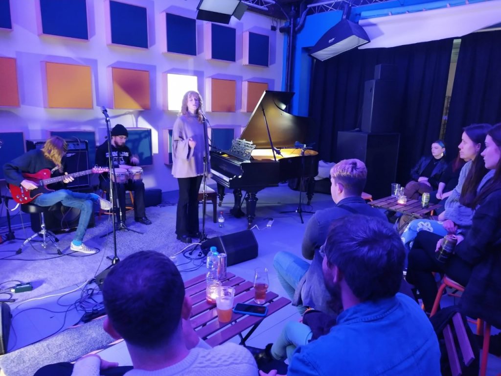 Students at an Open Mic Night event at The University of Salford