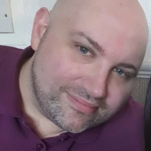 Headshot of Creative Writing graduate and Screenwriter Alan Taylor