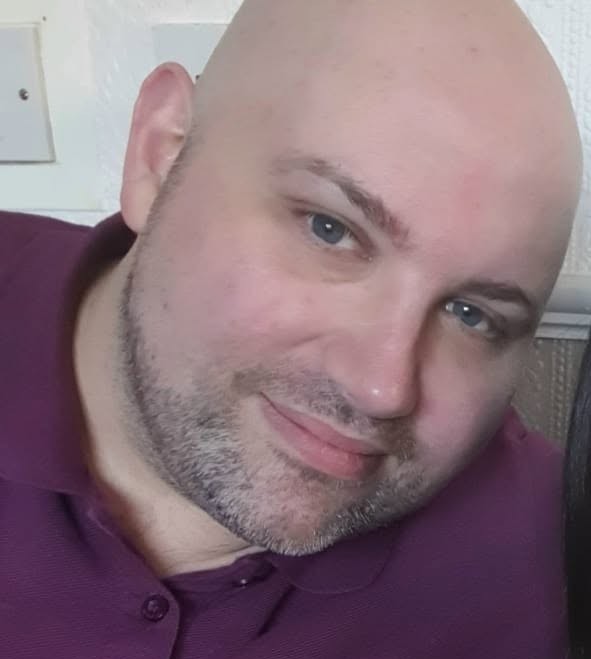 Headshot of Creative Writing graduate and Screenwriter Alan Taylor